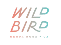 The image features the text "WILD BIRD" in gradient colors, with "SANTA ROSA • CA" written below in smaller letters.